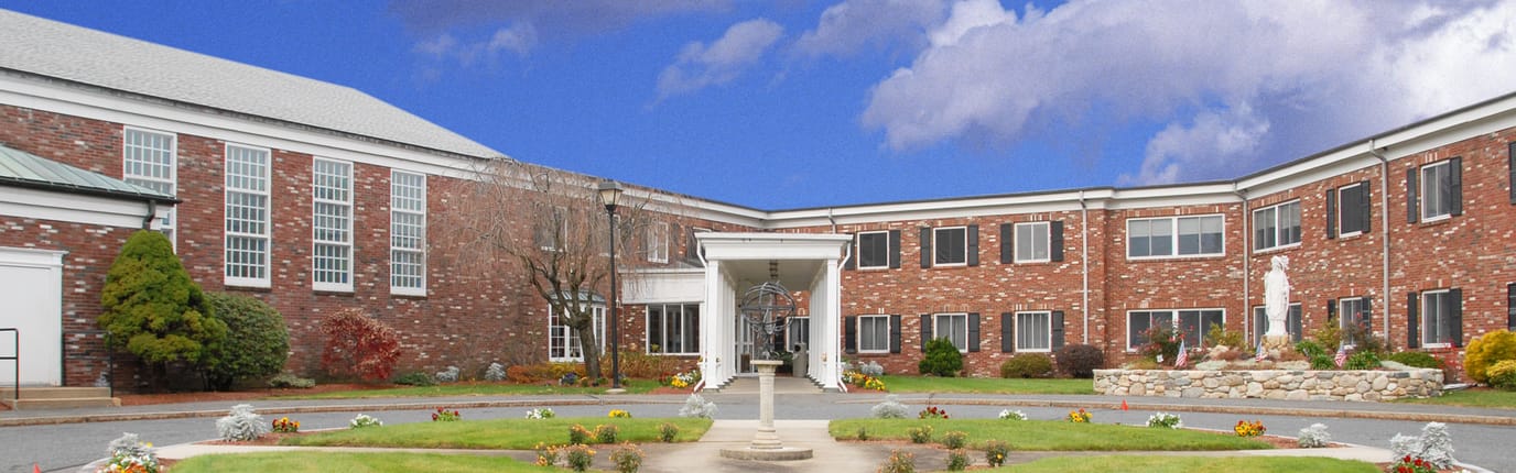Exterior view of St Patrick's Manor with landscaped grounds