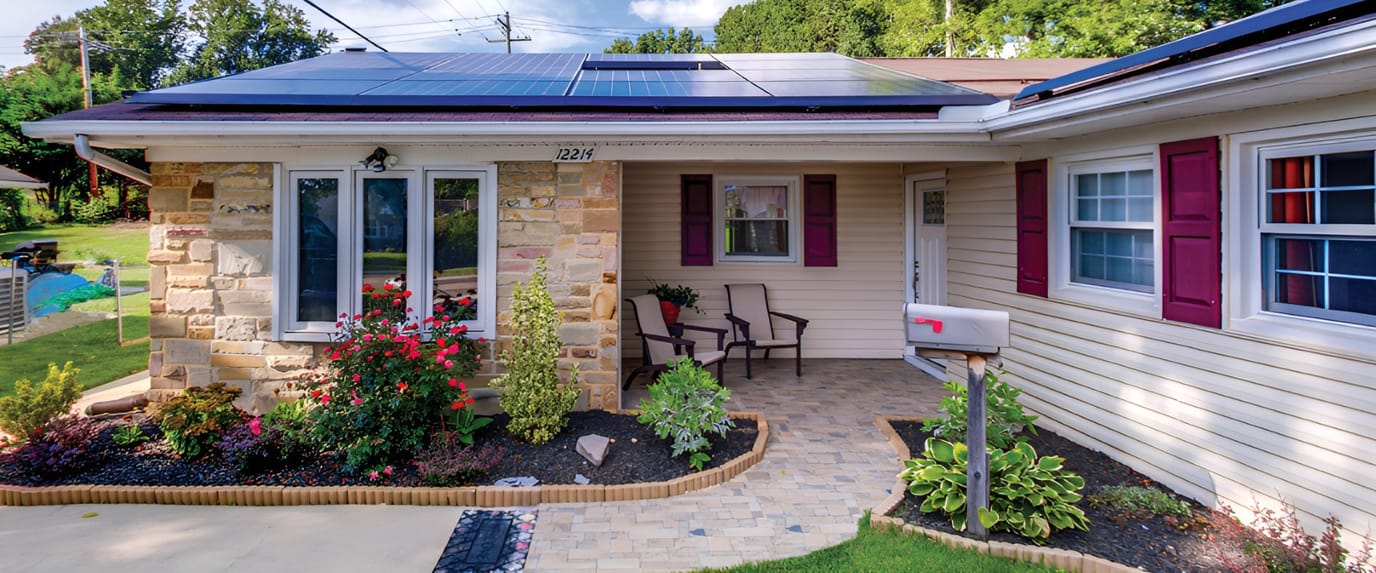 Exterior view of a residence with garden and solar panels