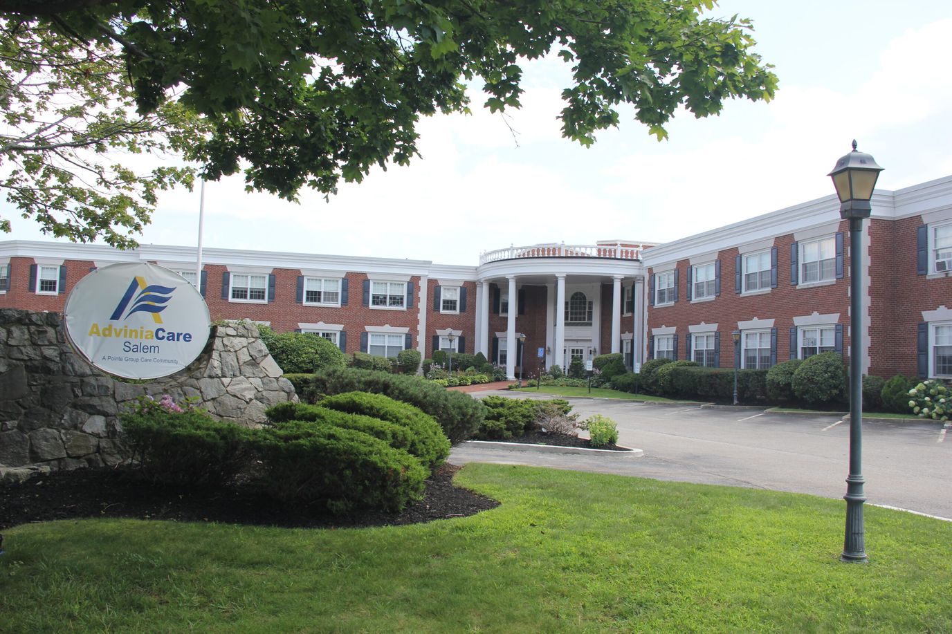 Exterior view of Adviniacare Salem facility with logo