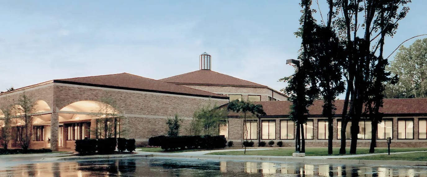 Exterior view of Woodward Hills facility with gardens