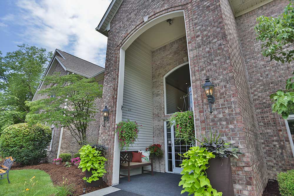 Building entrance with landscaped flowerpots