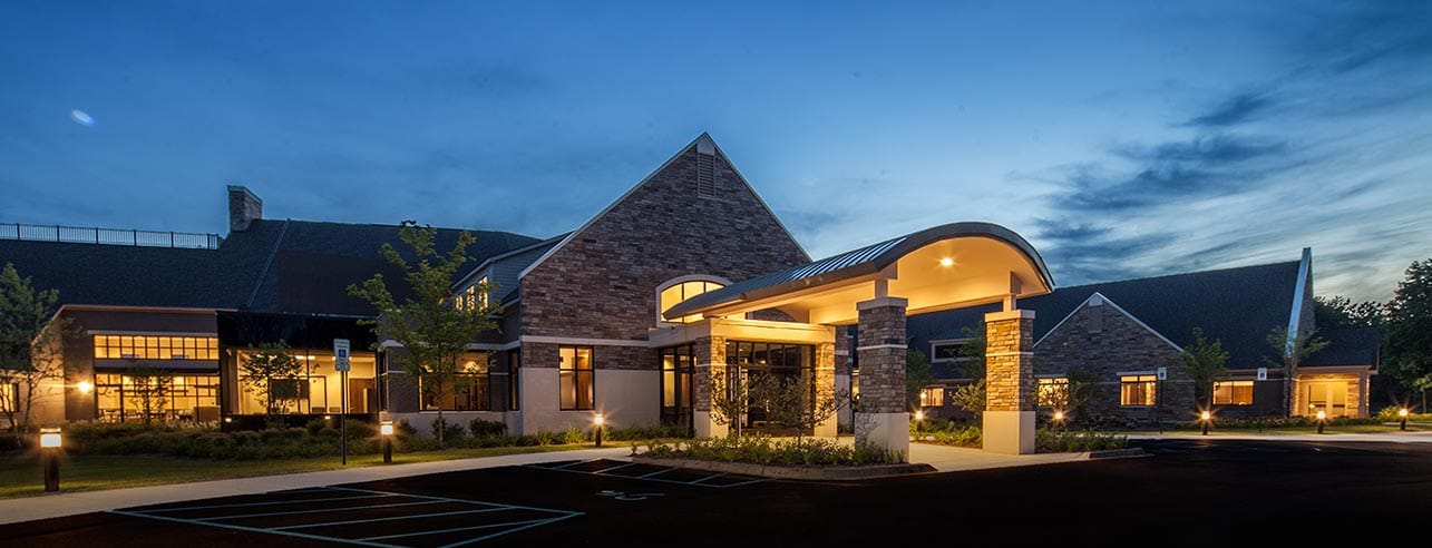 Exterior view of WellBridge of Novi during twilight