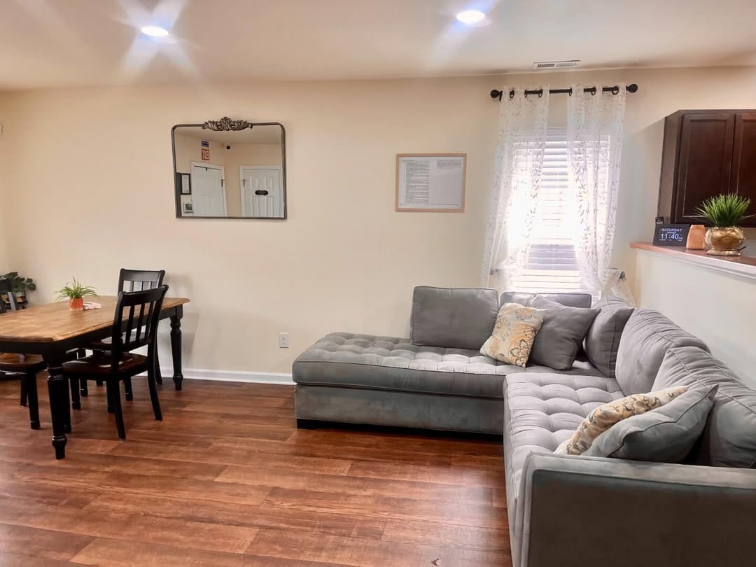 Cozy common area with a sofa and dining table