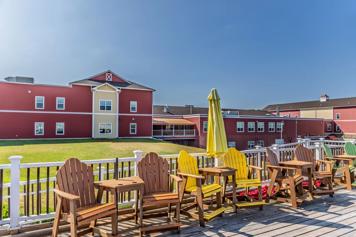 Outdoor seating area with yellow chairs and umbrellas