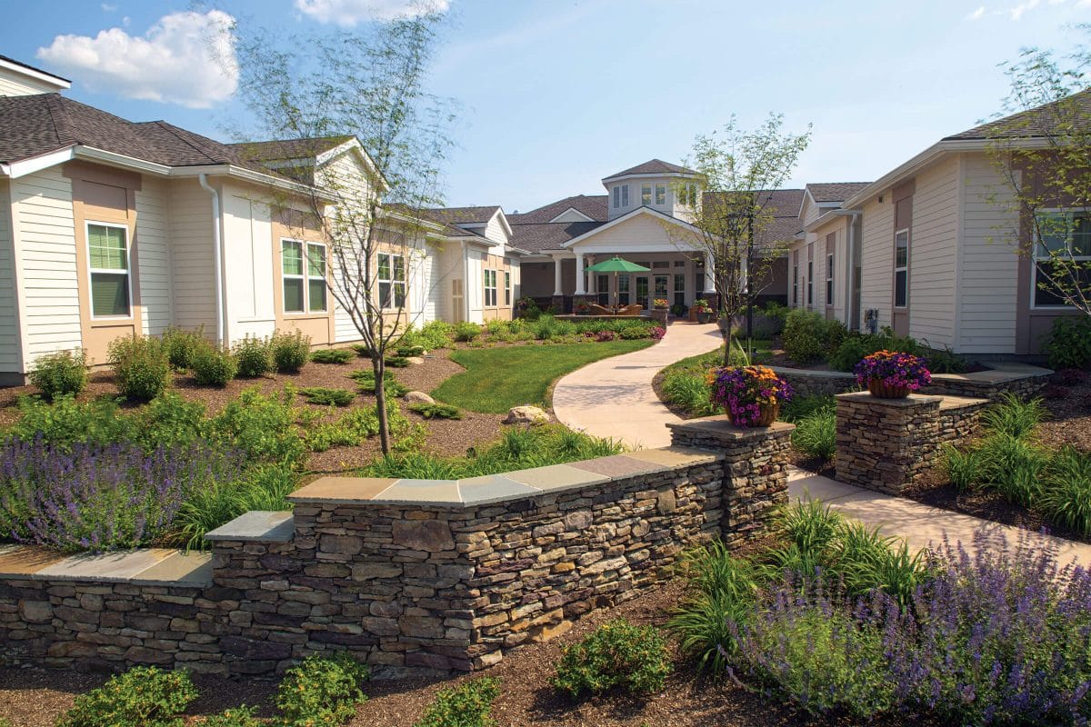 Beautifully landscaped pathway leading to the facility entrance