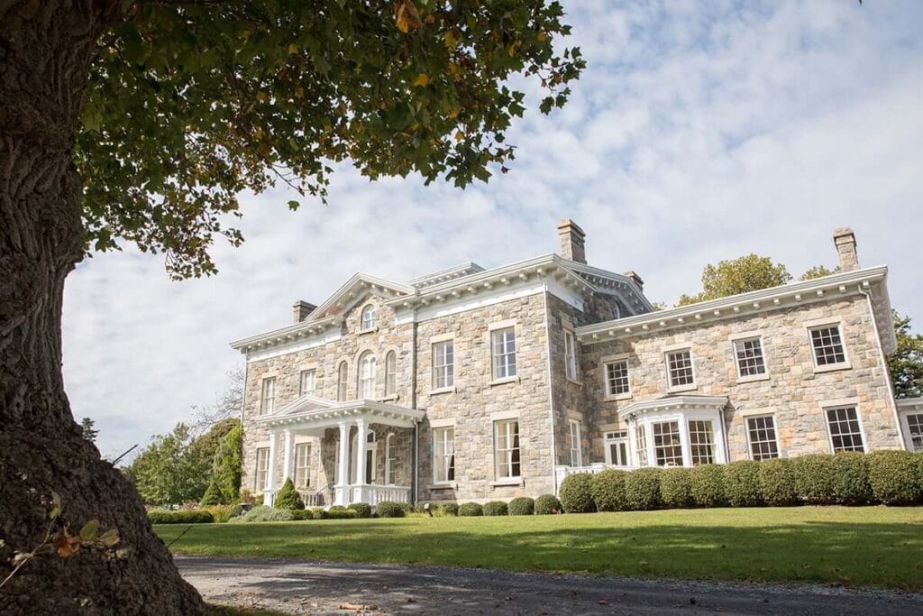 Exterior view of a large stone assisted living facility