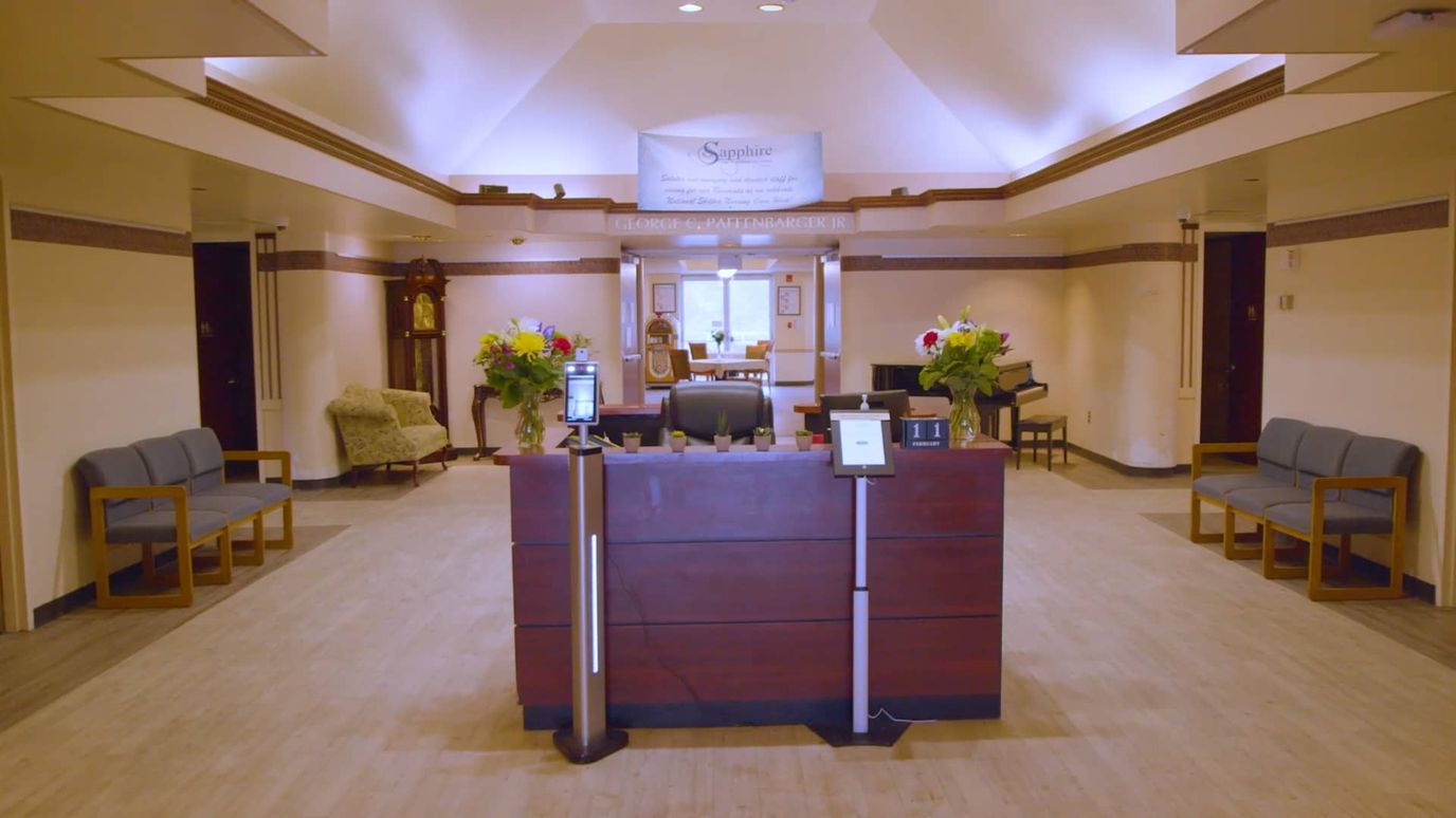 Interior view of the main reception area with seating and flowers