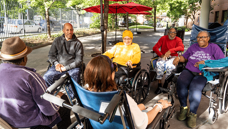 Residents engaged in a group activity outdoors