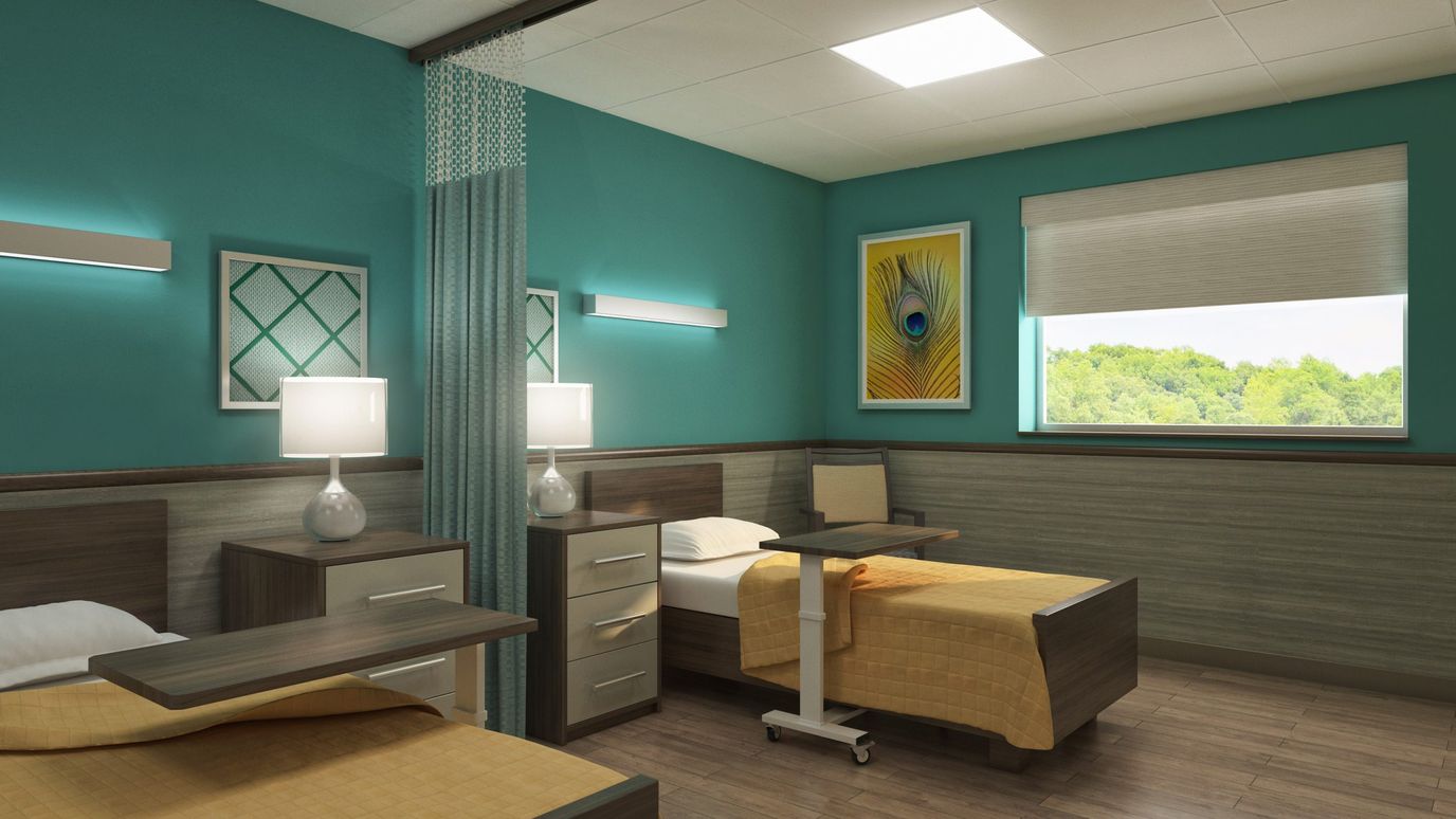 Bright interior of a shared resident room with beds and decor
