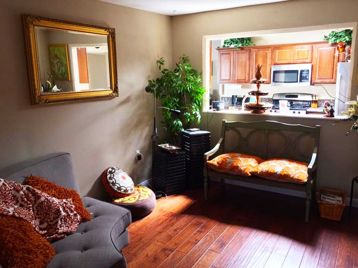 Cozy common area with a sofa and kitchenette