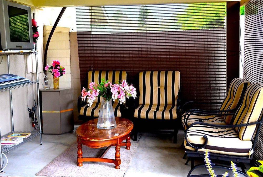 Cozy outdoor seating area with floral decor
