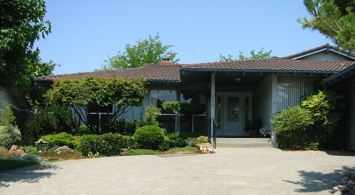 Front exterior of Abigail's Guest Home with gardens