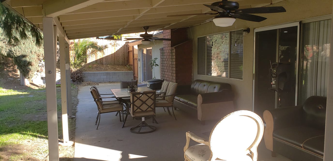 Outdoor seating area with tables and chairs
