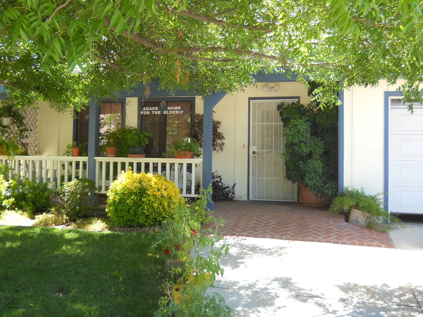 Exterior view of Agape Home for the Elderly with garden