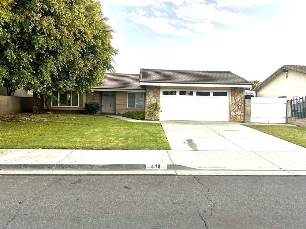 Exterior view of a residential facility with a front yard