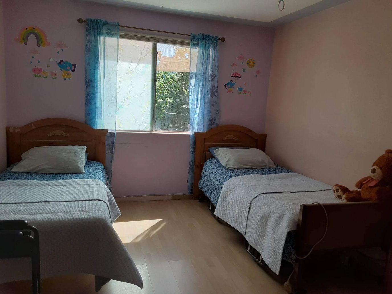Bright, shared resident room with two beds