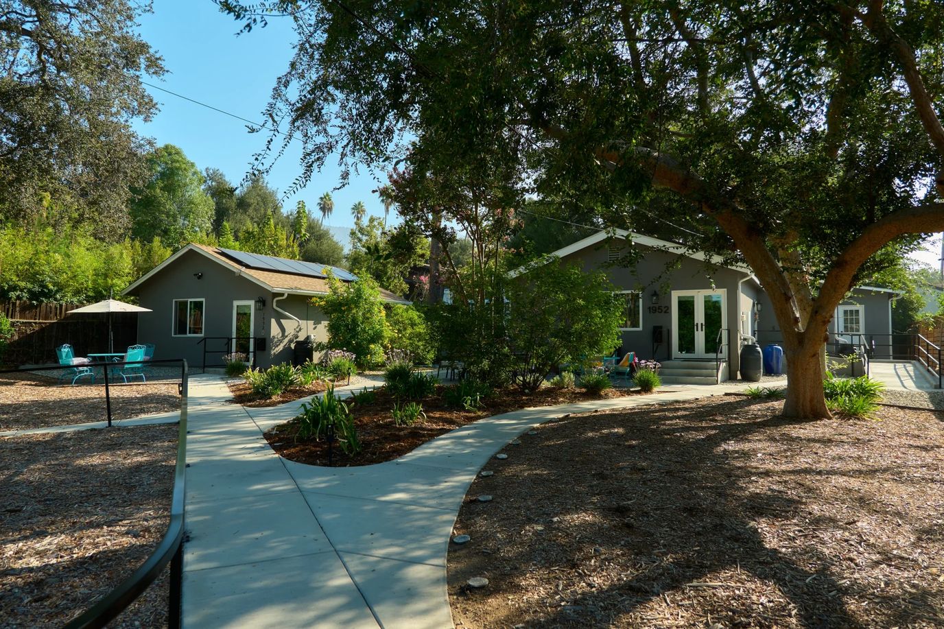 Exterior view of Azalea House with garden and path