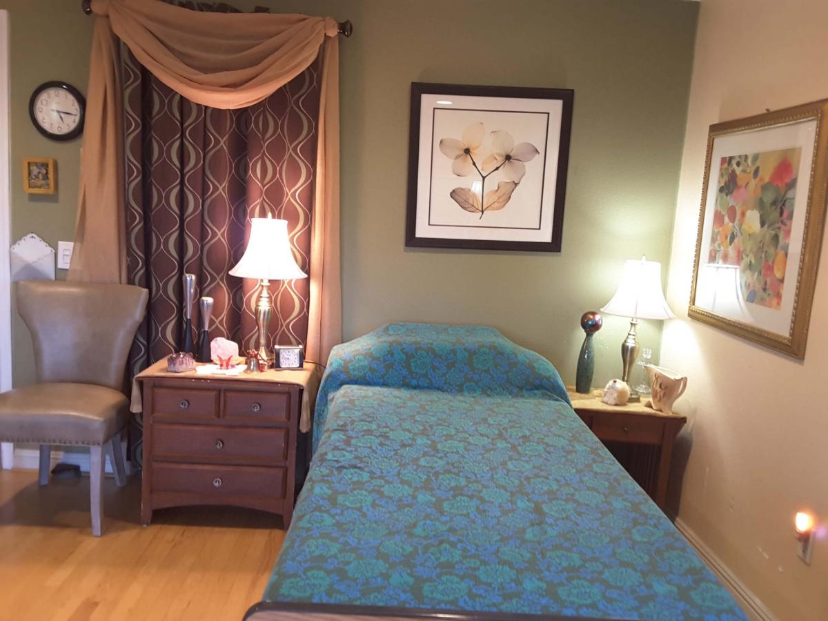 Cozy interior of a resident's room with a bed and decor