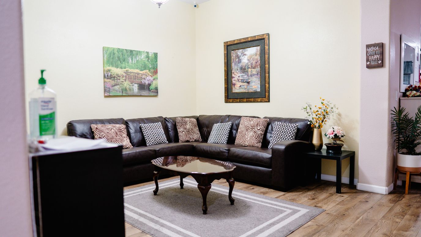 Cozy lounge area with a sectional sofa and artwork