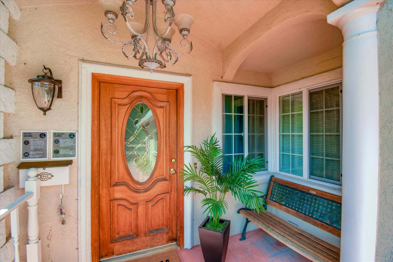 Entrance of a senior living facility with a decorative door