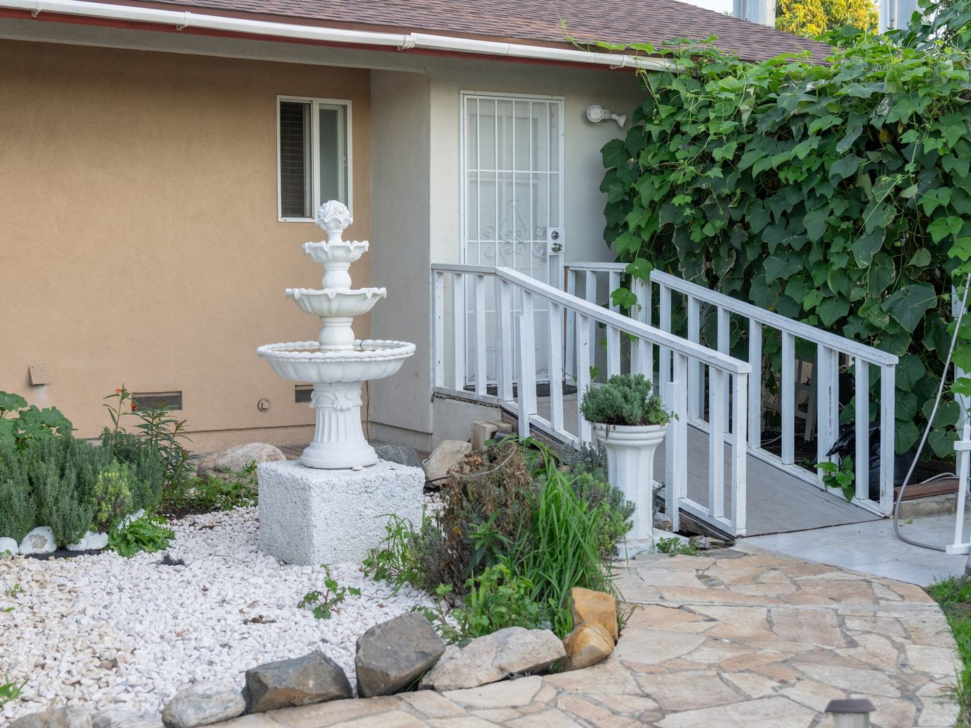Outdoor space with a fountain and accessible ramp