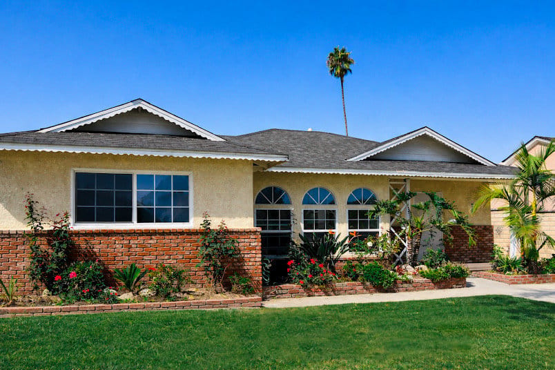 Exterior view of a senior care facility with landscaped entrance