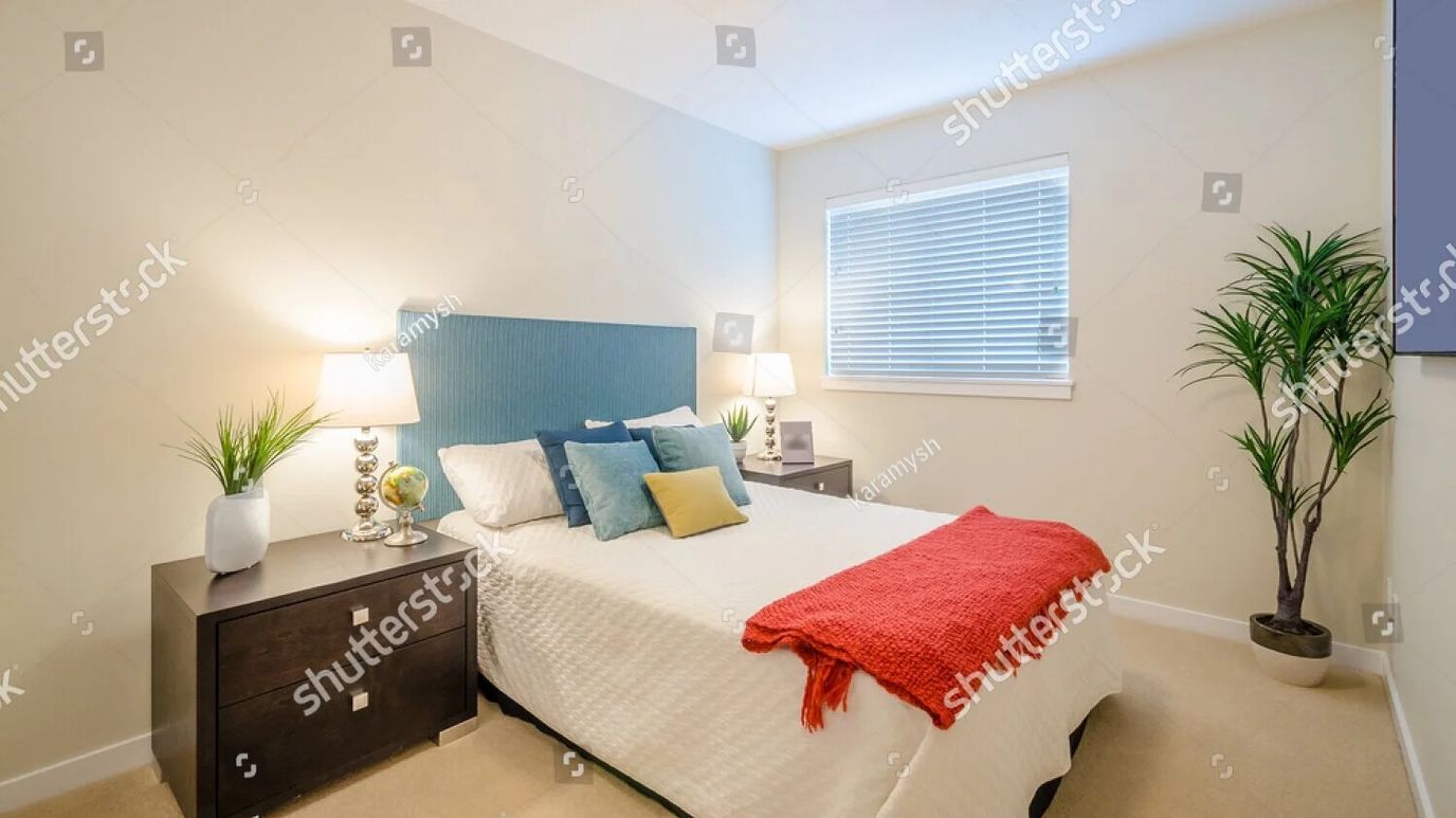 Brightly decorated bedroom with cozy furnishings