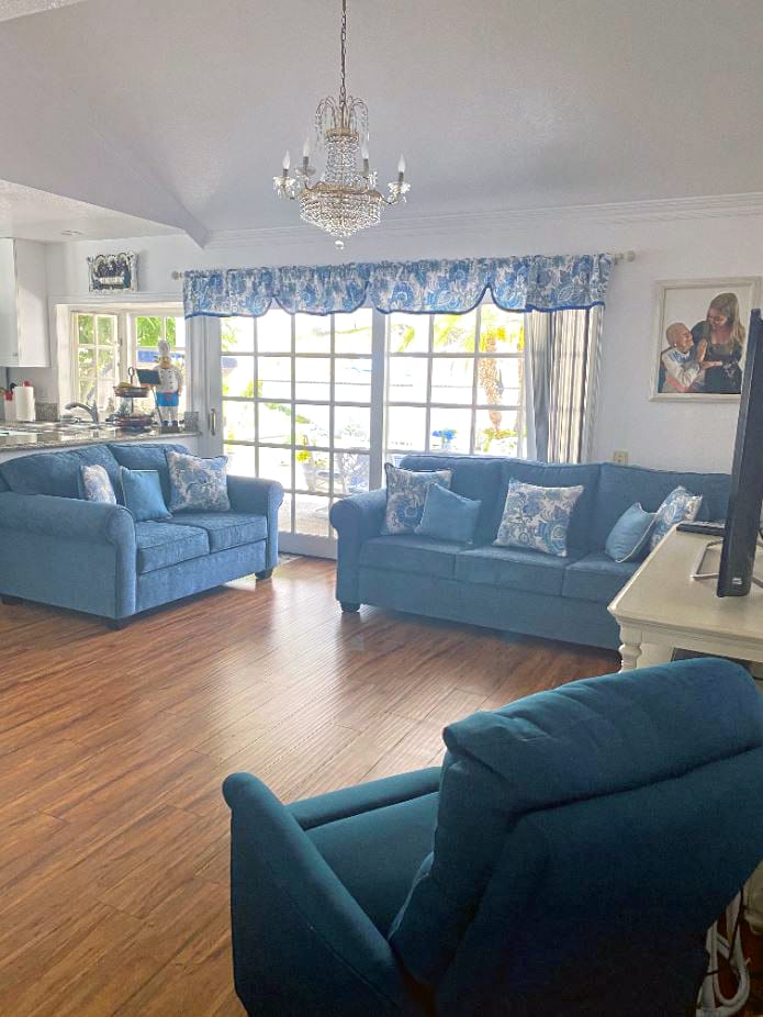 Comfortable living room area with blue furniture