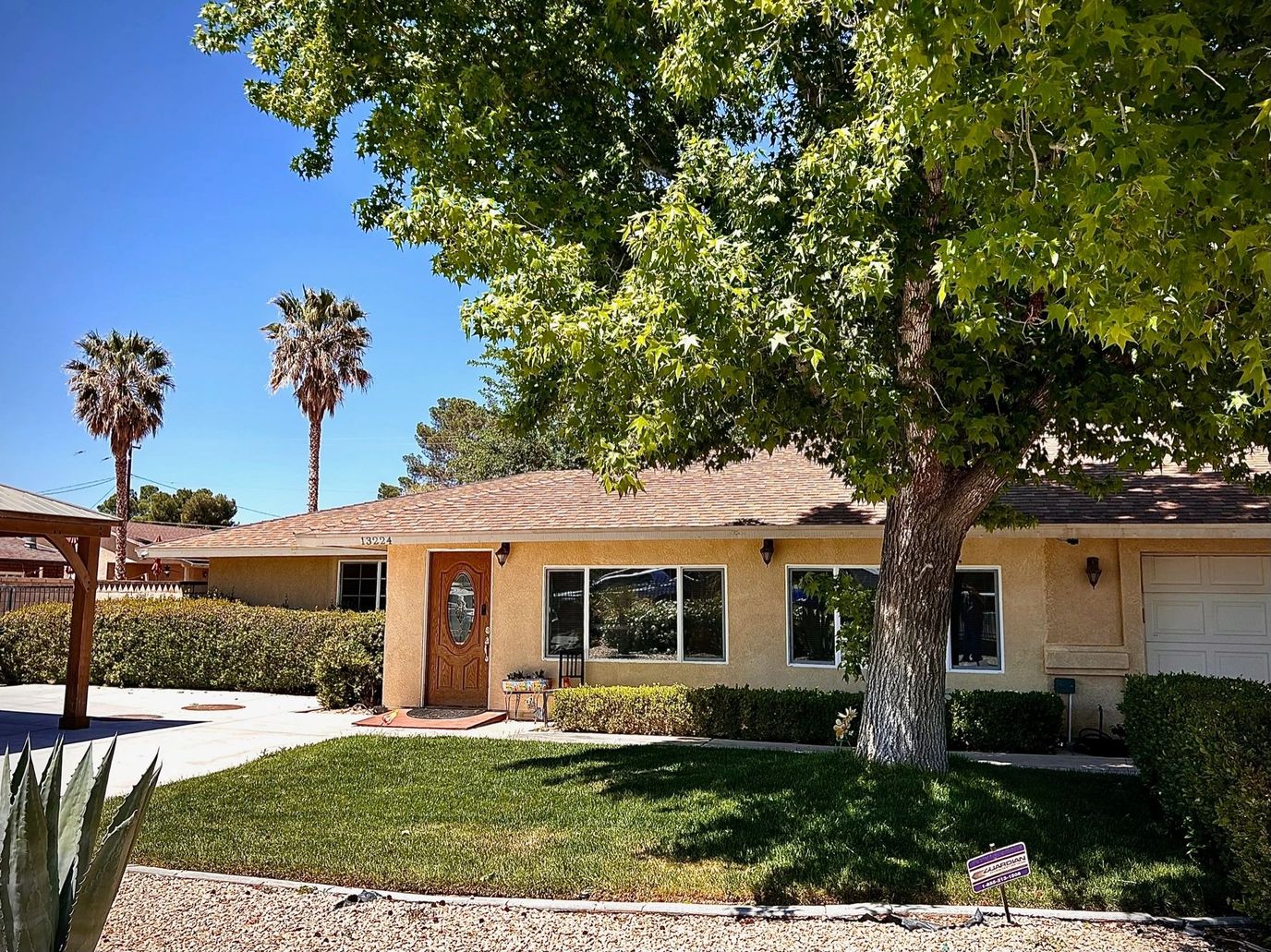 Exterior view of a residential care facility with trees