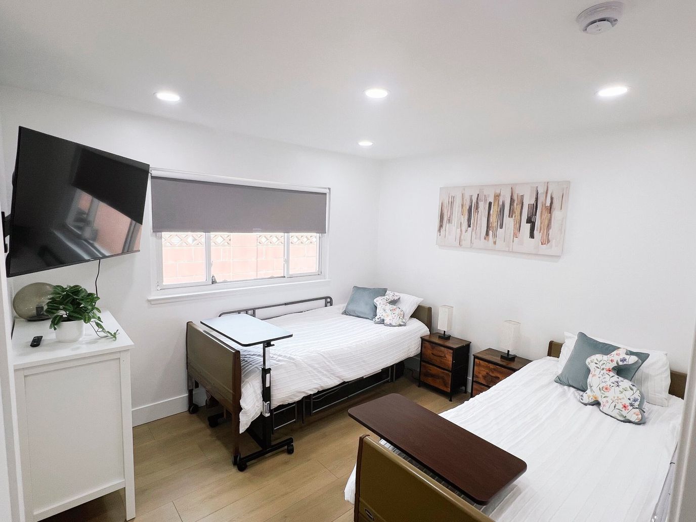 Bright interior of a shared resident room with two beds