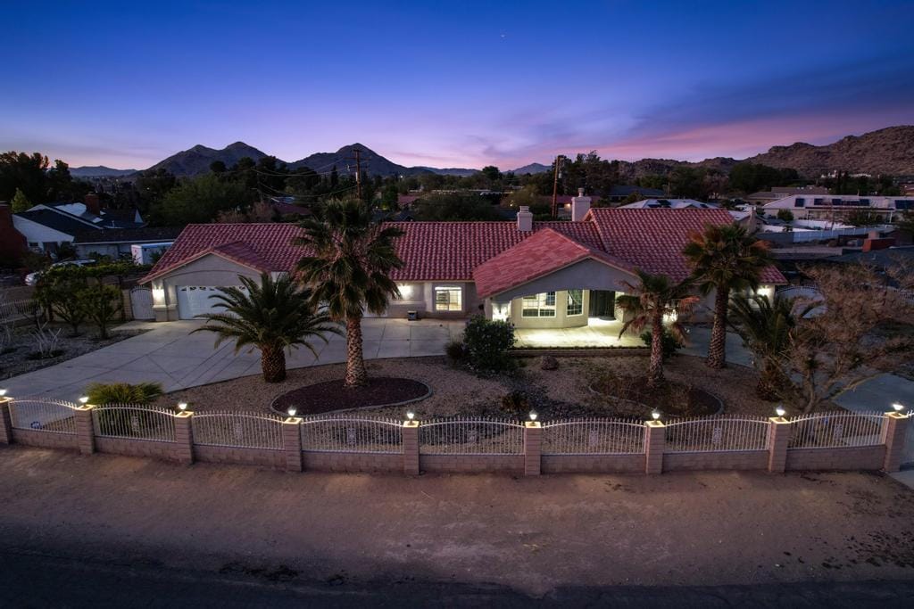 Aerial view of a single-story home at dusk