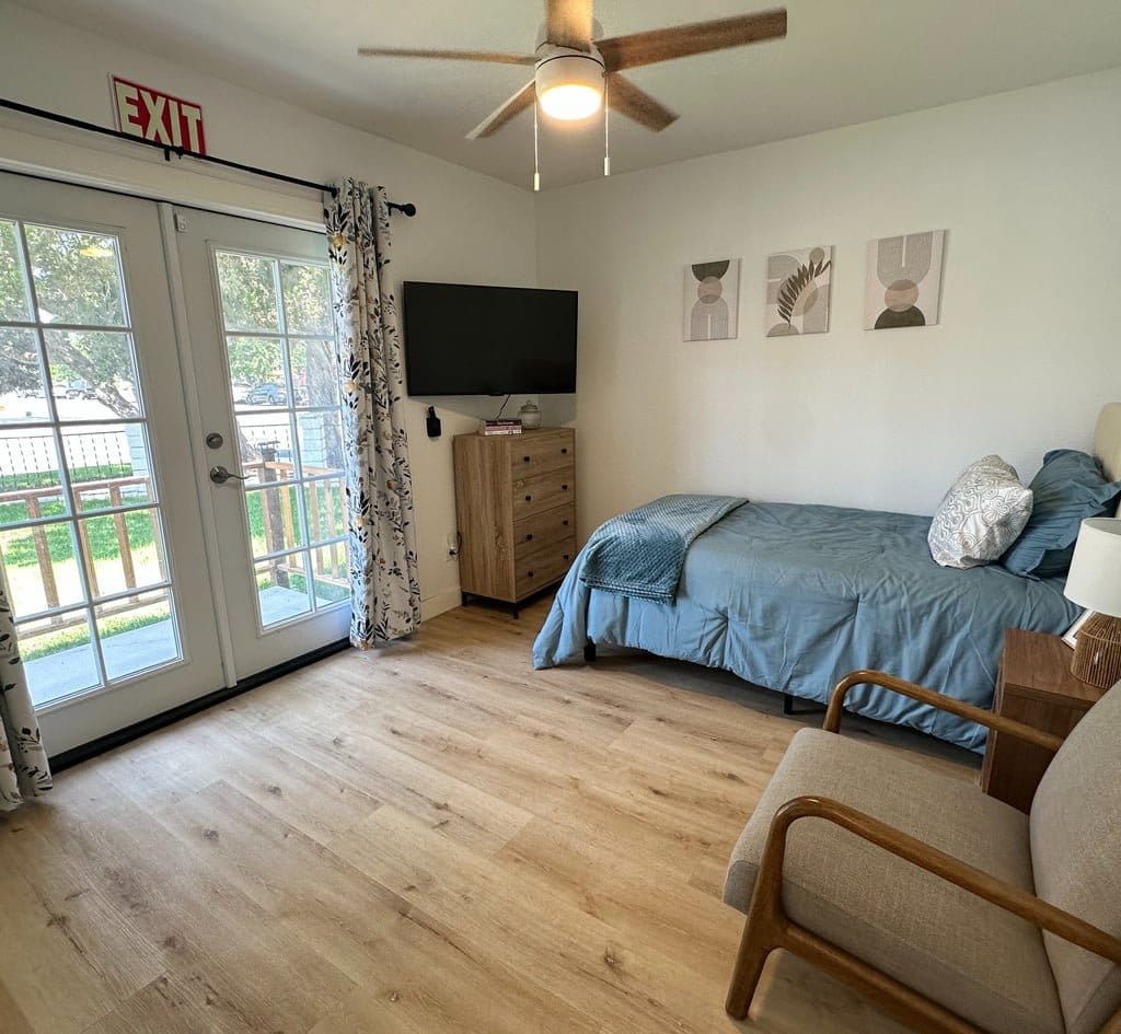 Cozy resident room with a bed and TV
