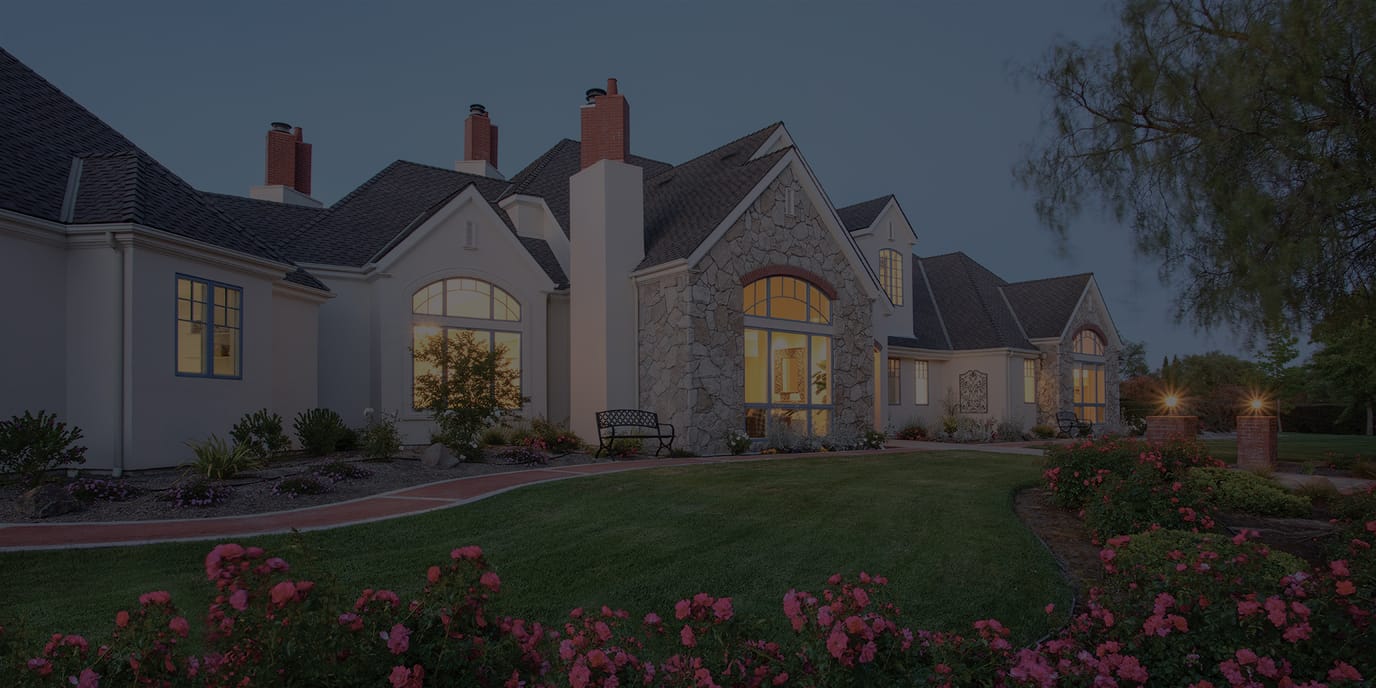 Exterior view of a senior living facility at dusk