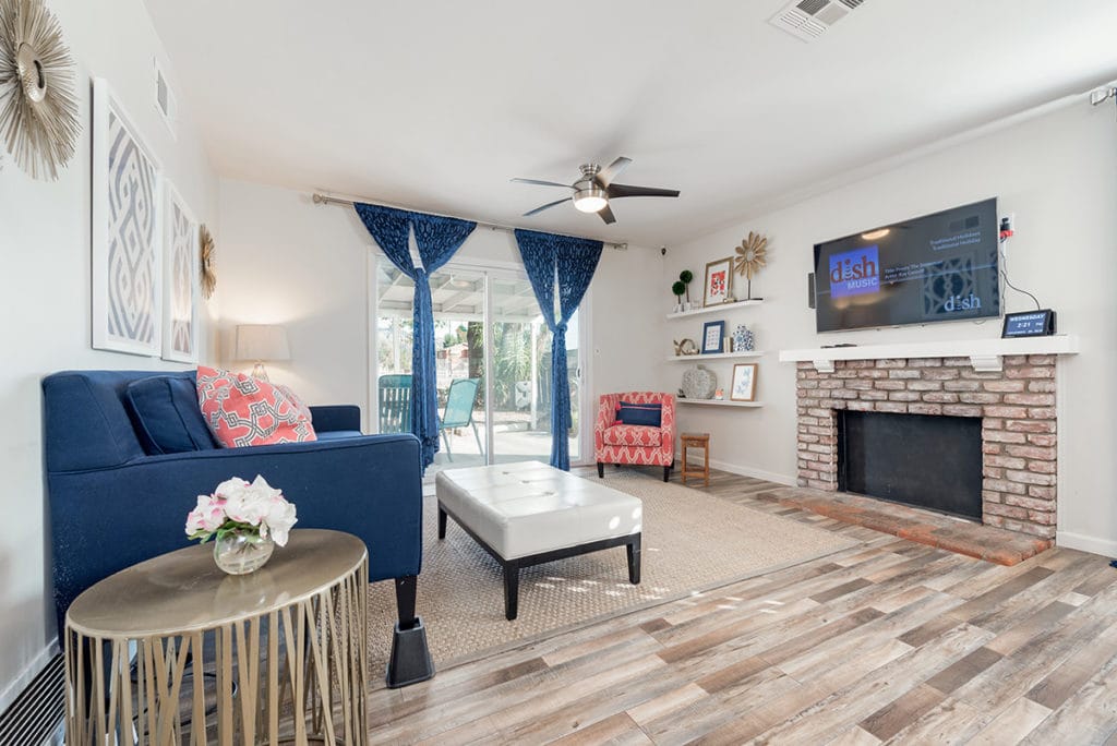 Bright common area with seating and a television