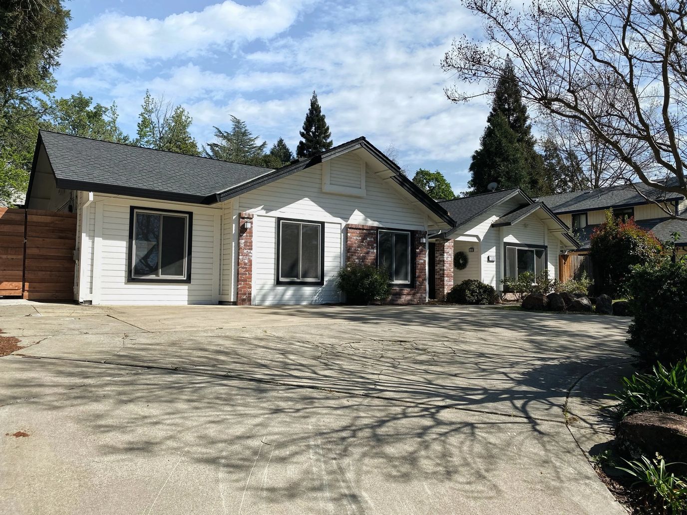 Exterior view of a senior living facility with landscaped entrance
