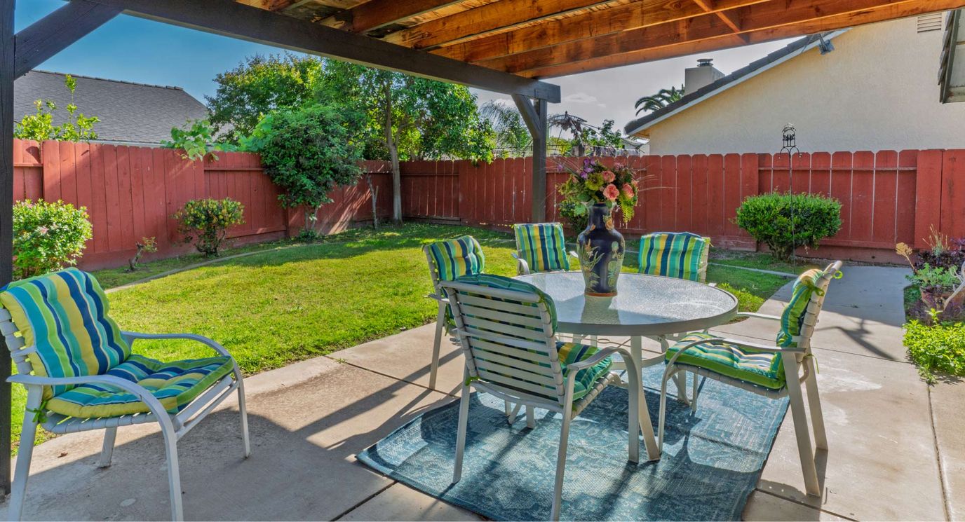 Outdoor patio with seating and garden view