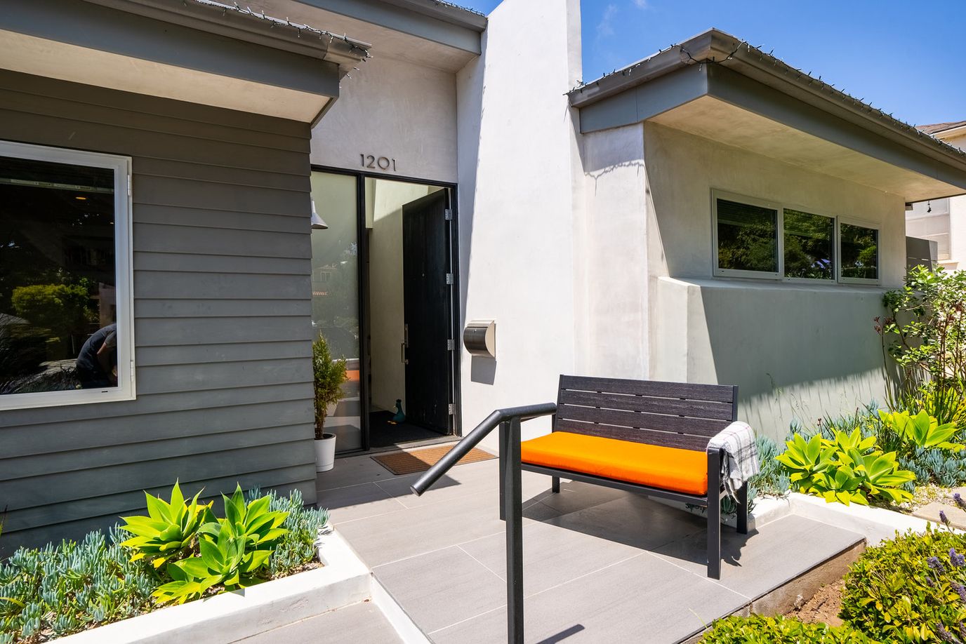 Front view of a facility entrance with landscaping
