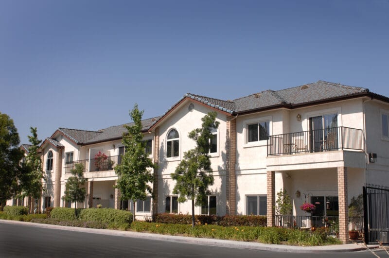 Exterior view of a senior living facility with balconies