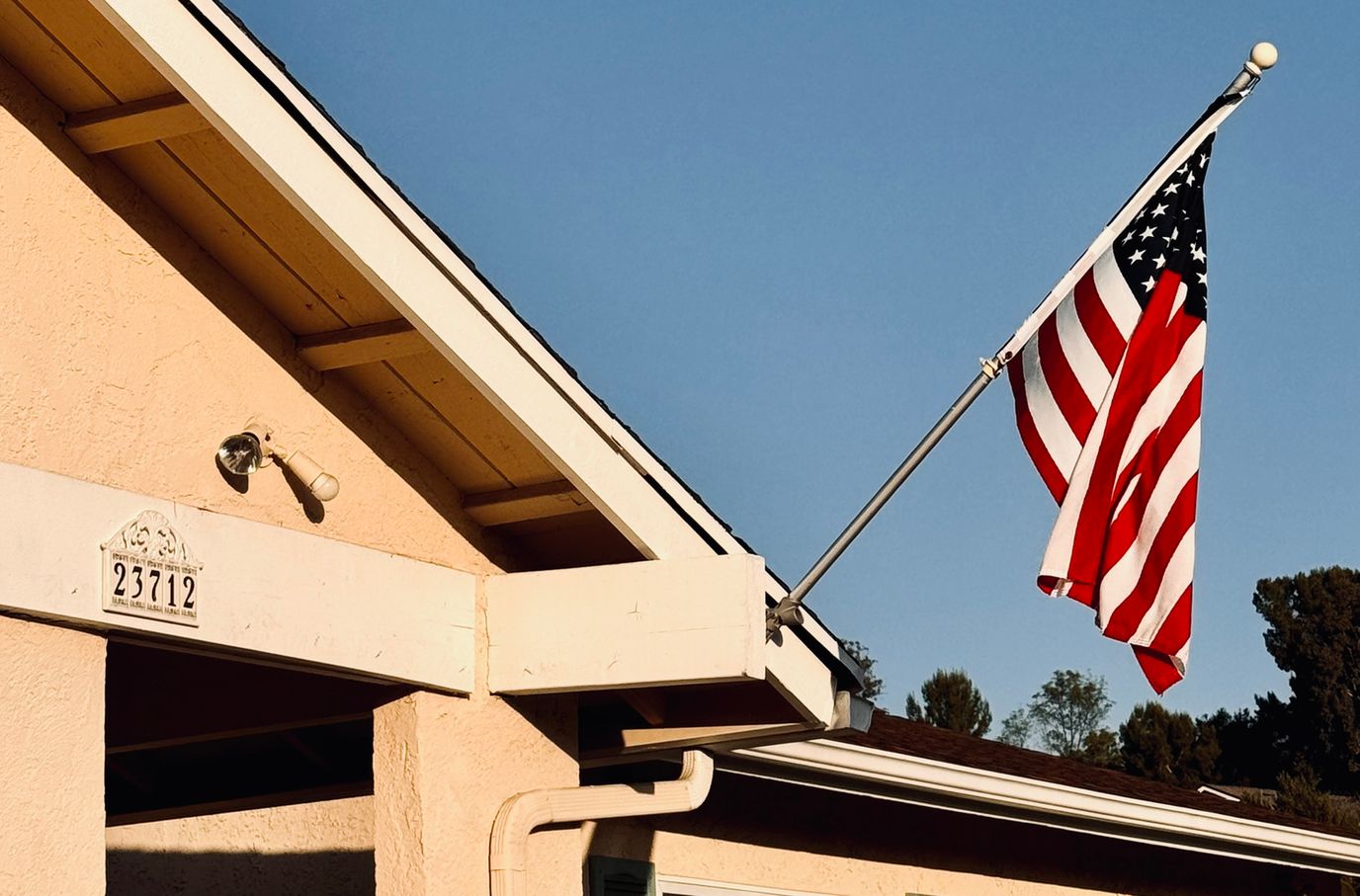 Exterior view of a nursing home with an American flag