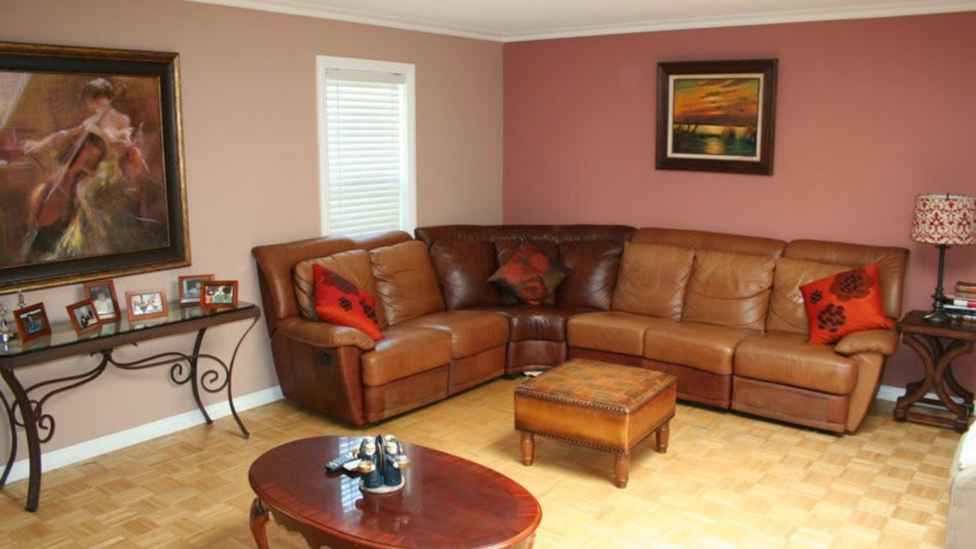 Cozy common area with leather seating and artwork