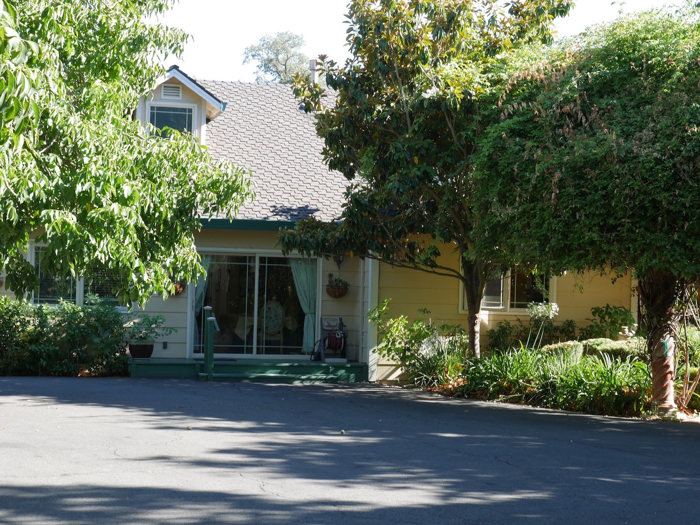 Exterior view of a senior living facility surrounded by greenery