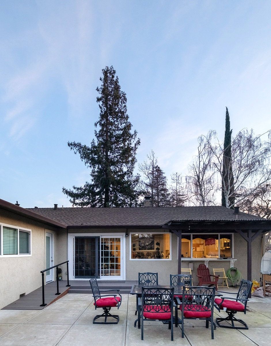 Exterior view of a senior care facility with outdoor seating