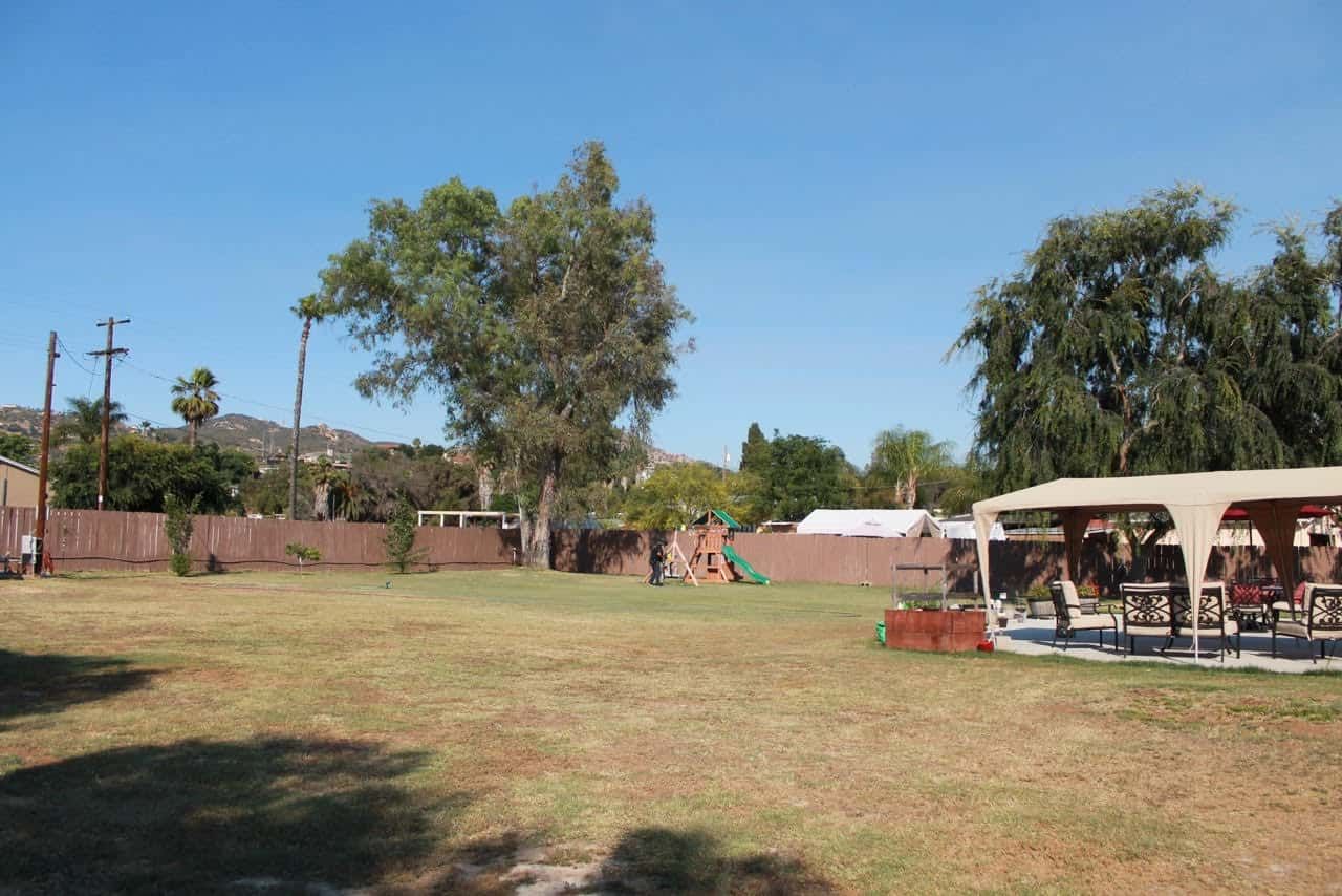 Spacious outdoor area with playground and seating
