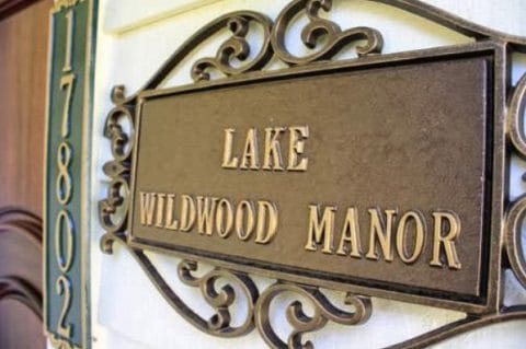 Facility name plaque at the entrance of Lake Wildwood Manor