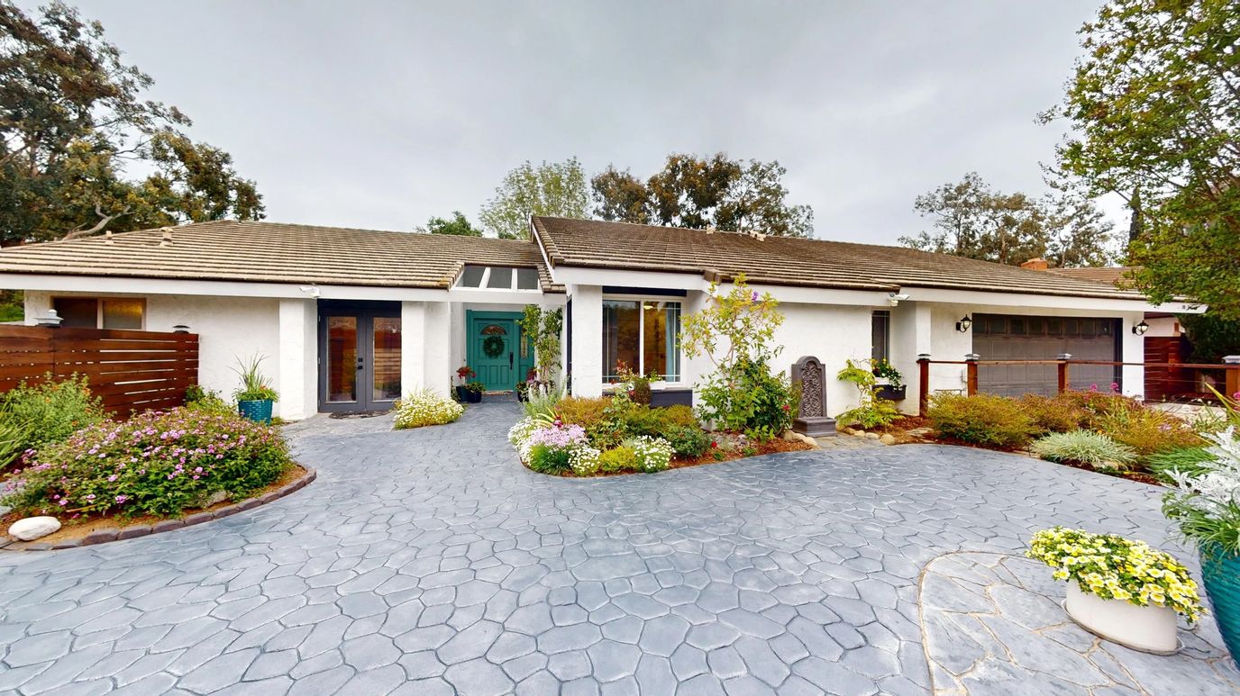 Exterior view of The Legacy Collection at Sidlee with gardens