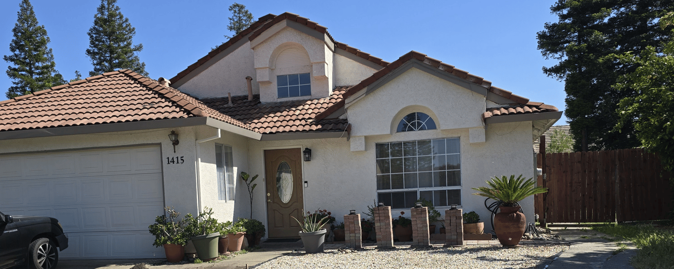Exterior view of a residential care home with landscaping