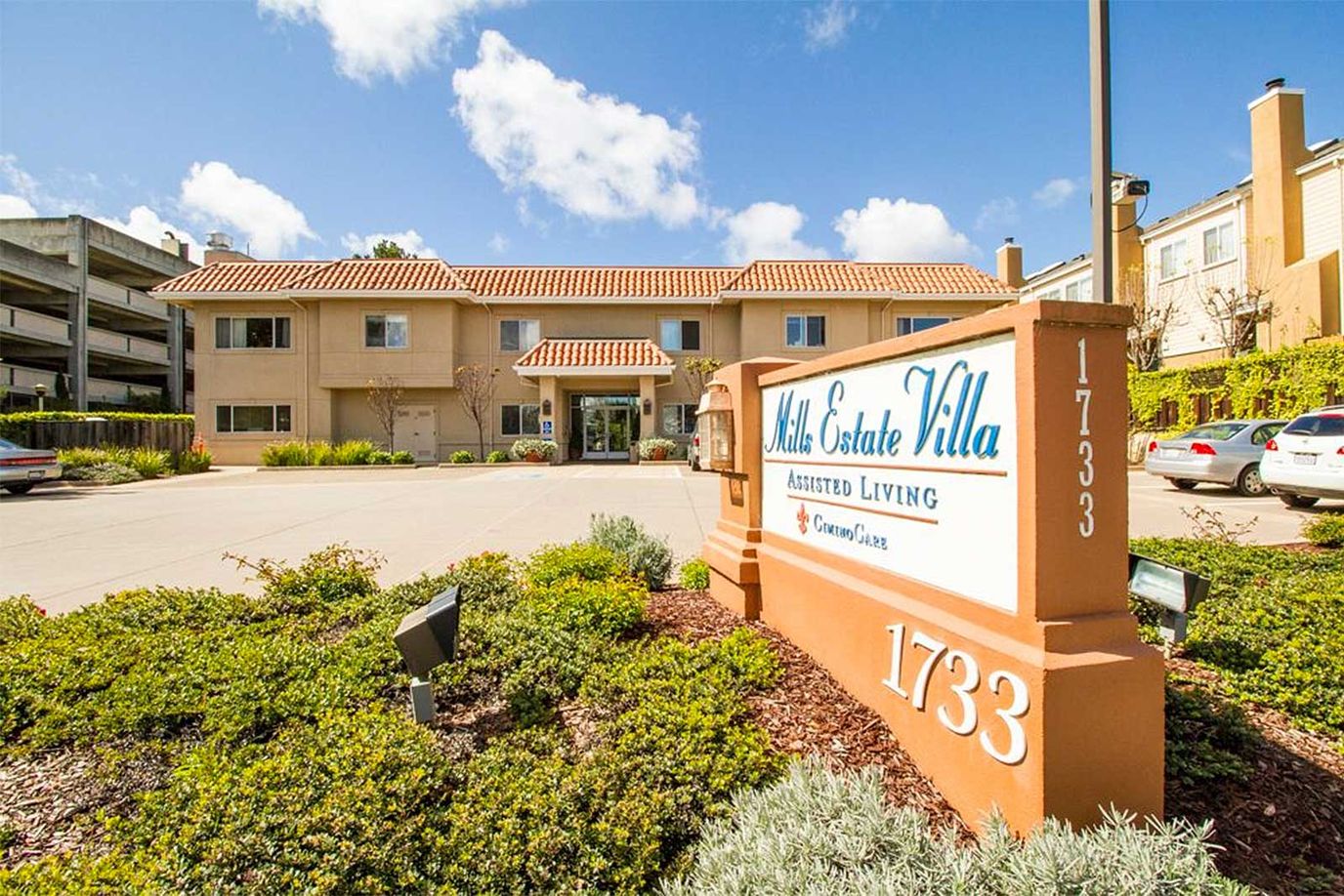 Exterior view of Mills Estate Villa with signage