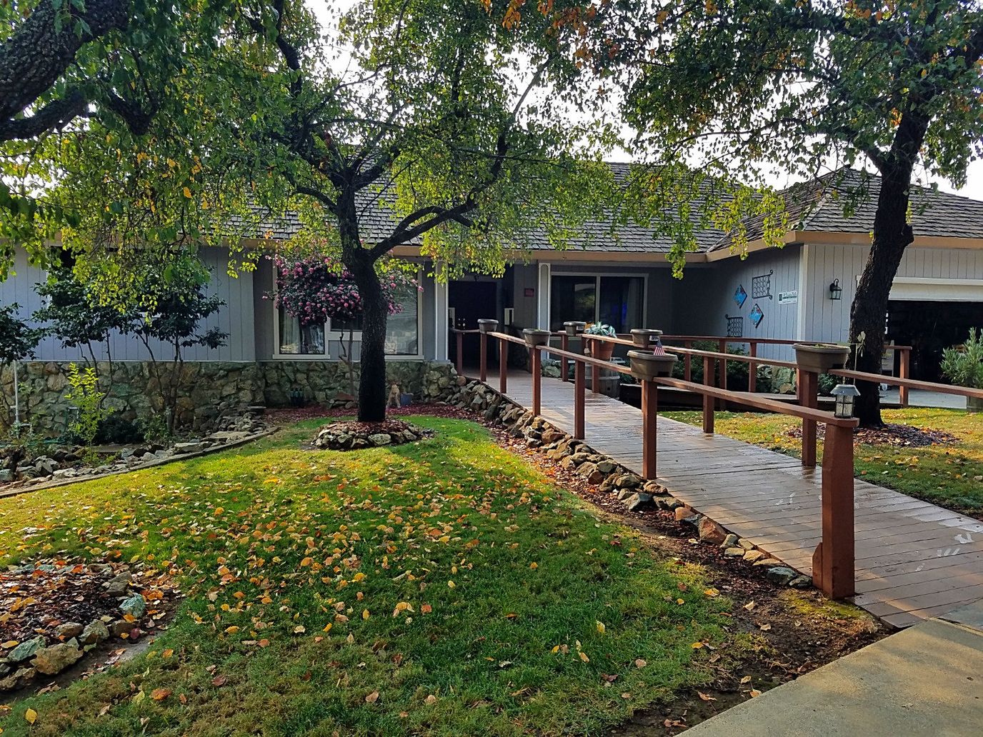 Exterior view of Oak Hill Senior Care with pathway and landscaping