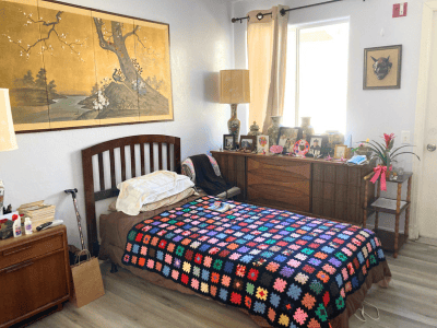 Cozy resident room with colorful blanket and decor