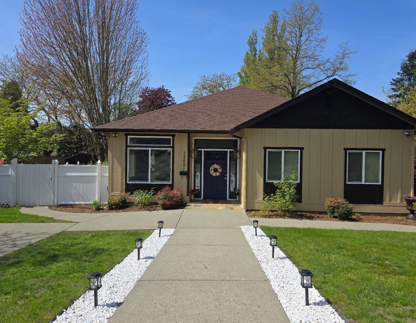 Exterior view of a senior living facility with a garden